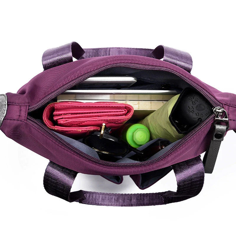 Versatile ladies handbag in various colors with multiple carry options, including handbag, shoulder bag, and crossbody styles, featuring durable construction and organizational pockets.
