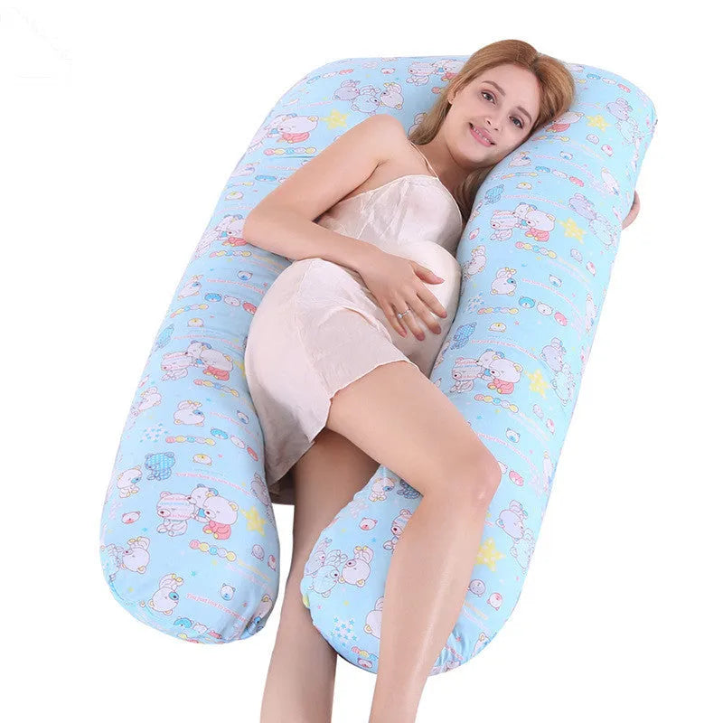 Large U-shaped pregnancy support pillow with removable cover and abdominal support belt.