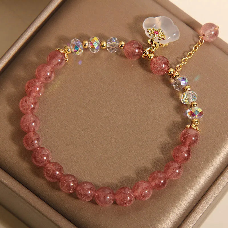 Women's adjustable crystal bracelet with strawberry quartz, white agate beads, and auspicious cloud charms
