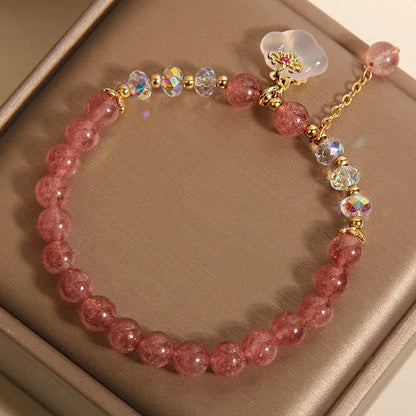 Women's adjustable crystal bracelet with strawberry quartz, white agate beads, and auspicious cloud charms