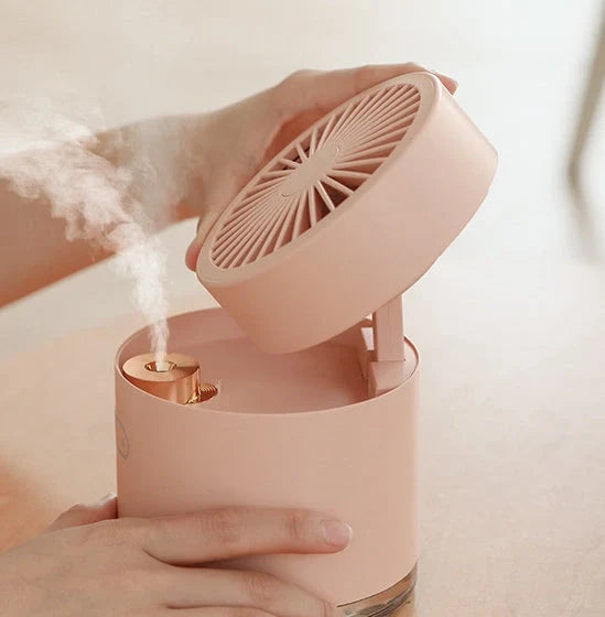Mini portable USB rechargeable spray fan in green, pink, and white