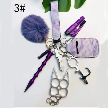 Self-defense keychain set for women with 11 safety tools including alarm and window breaker