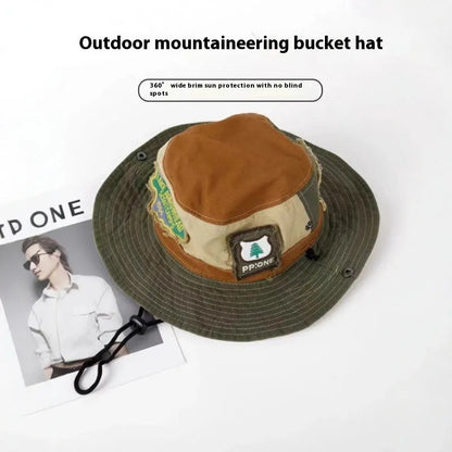 Army green cotton foldable fisherman hat with flat top crown and hand-painted patchwork design