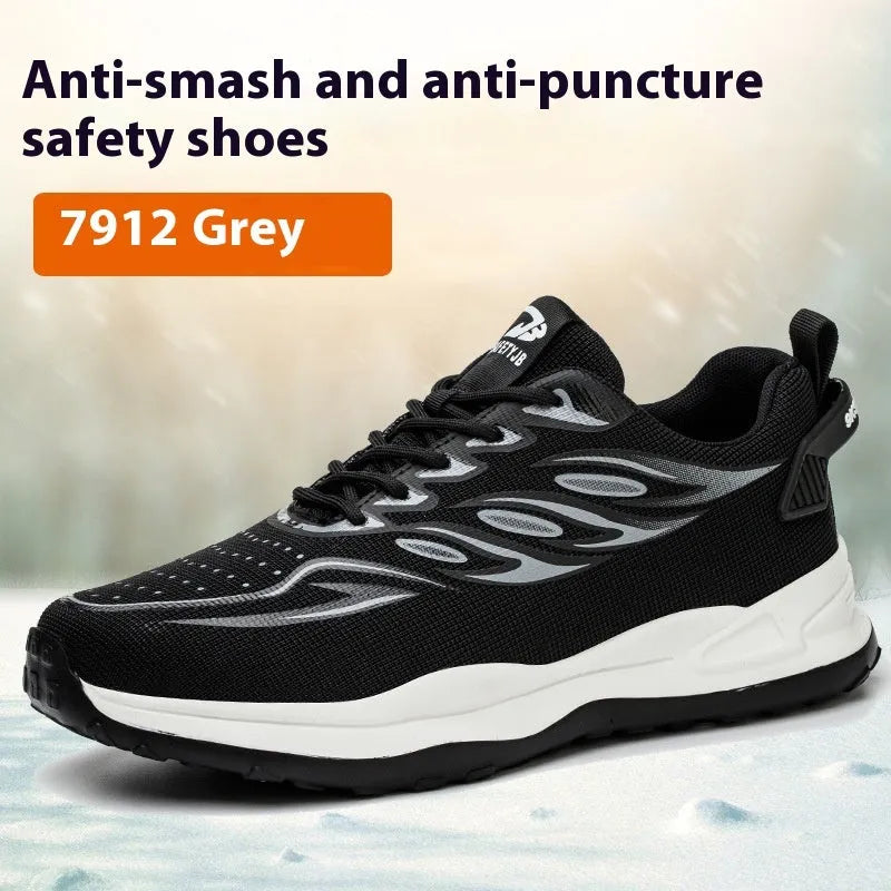 Lightweight orange and grey safety shoes with leather upper and rubber sole on a work floor.