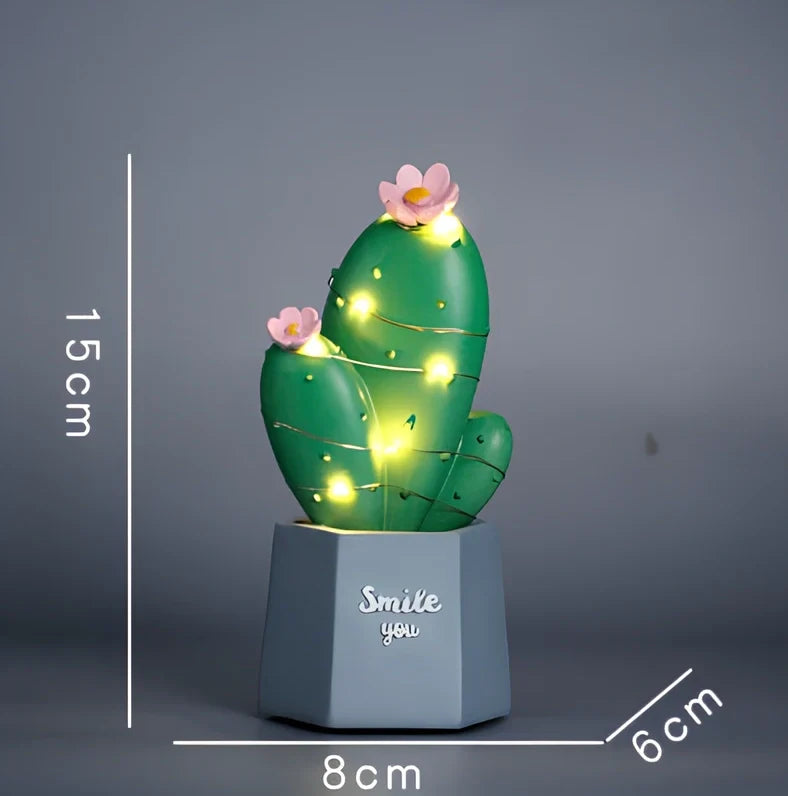 Cactus-shaped resin night light in gold finish measuring 15cm tall with warm LED glow