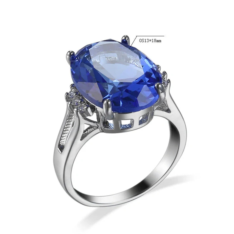 Geometric ellipse ring with electroplated blue black finish on copper, showing distinctive angles and curves