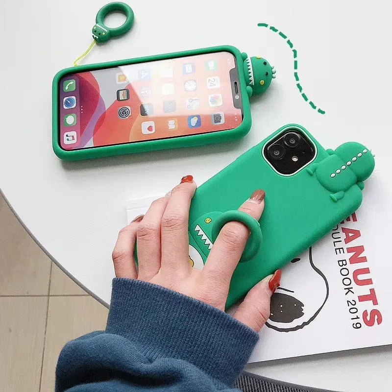 Green silicone iPhone case with animal cartoon design showing drop and waterproof protection features