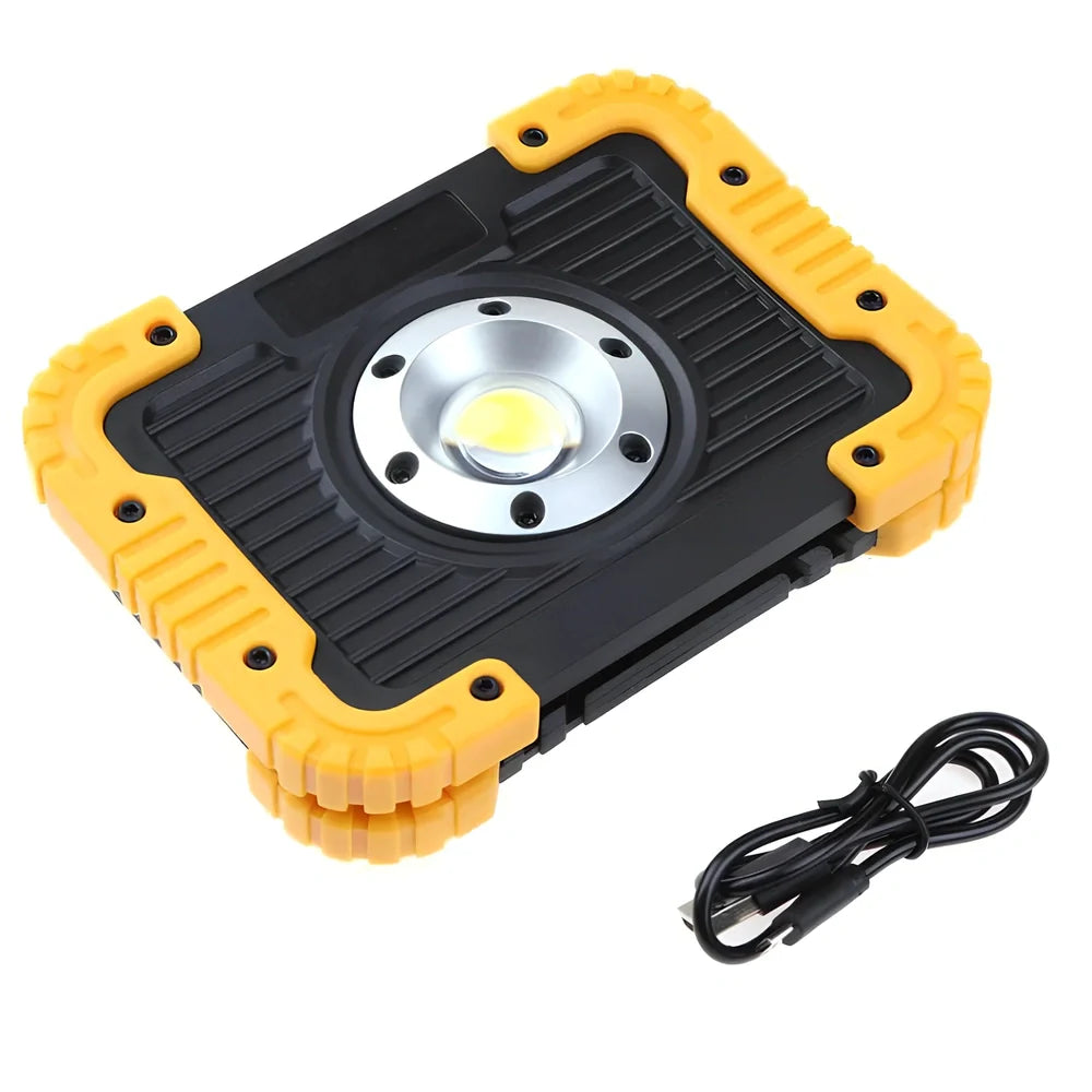 LED camping lantern with rotatable support showing USB ports and battery indicator lights