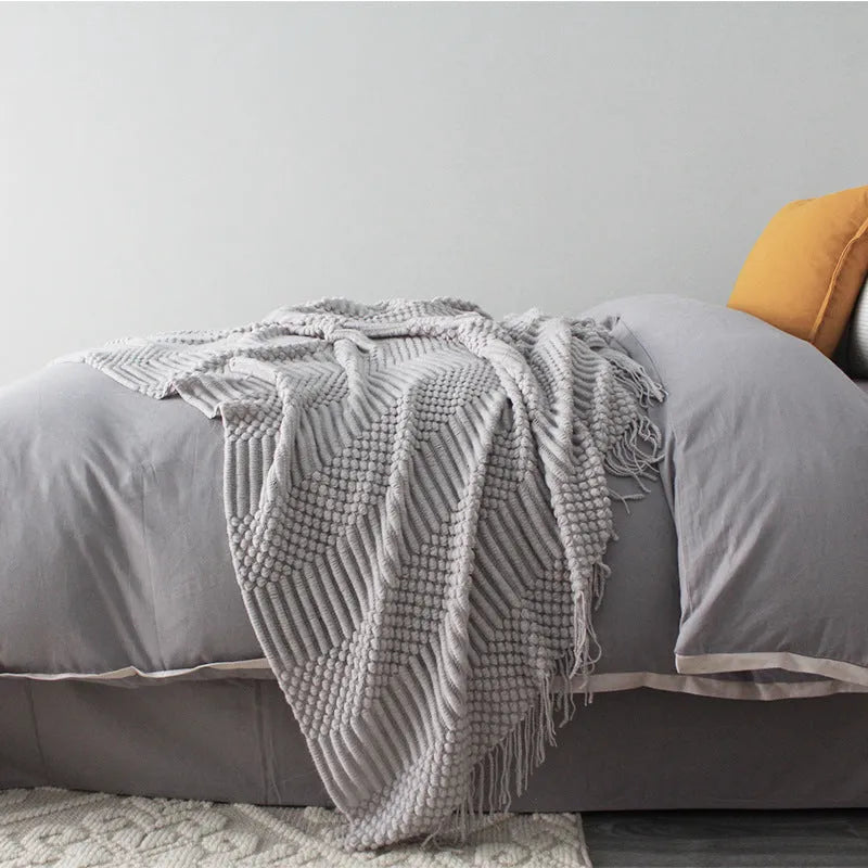 Polyester small blanket shown in dark grey, measuring 127 by 170 centimetres.