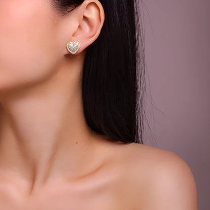 Golden S925 silver stud earrings with a heart-shaped moissanite stone.