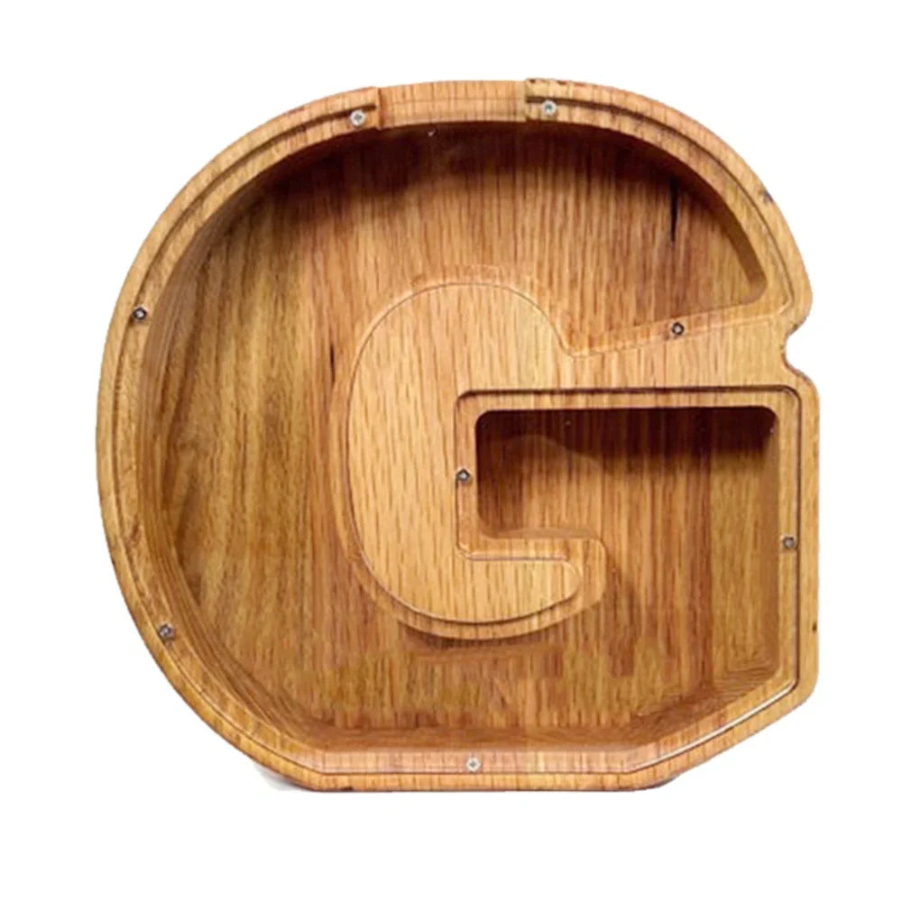 Handmade wooden letter piggy bank with personalised initial, showing 15cm height and 5cm coin slot for UK coins