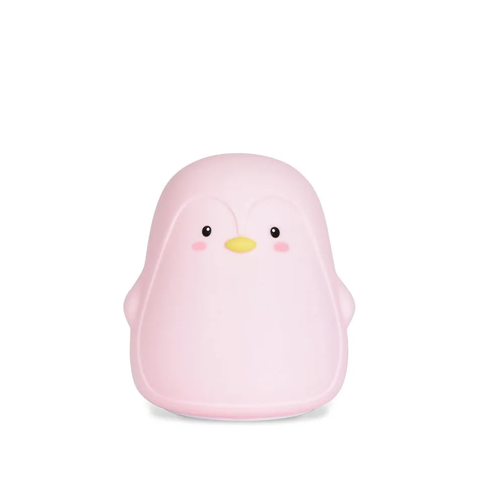 White silicone penguin-shaped USB rechargeable night light on a surface.
