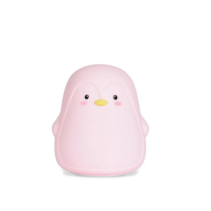 White silicone penguin-shaped USB rechargeable night light on a surface.