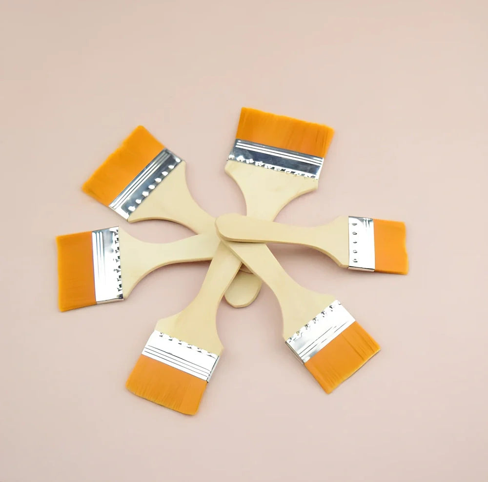 Nylon bristle paint brush with wooden handle measuring 14-18cm length in raw wood colour