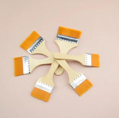 Nylon bristle paint brush with wooden handle measuring 14-18cm length in raw wood colour