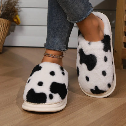 Cozy plush cow-print slippers with non-slip soles for comfortable indoor wear