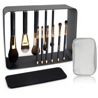 A premium makeup brush set with a sleek black and gold design, featuring 11 essential brushes and a magnetic holder for easy organization.