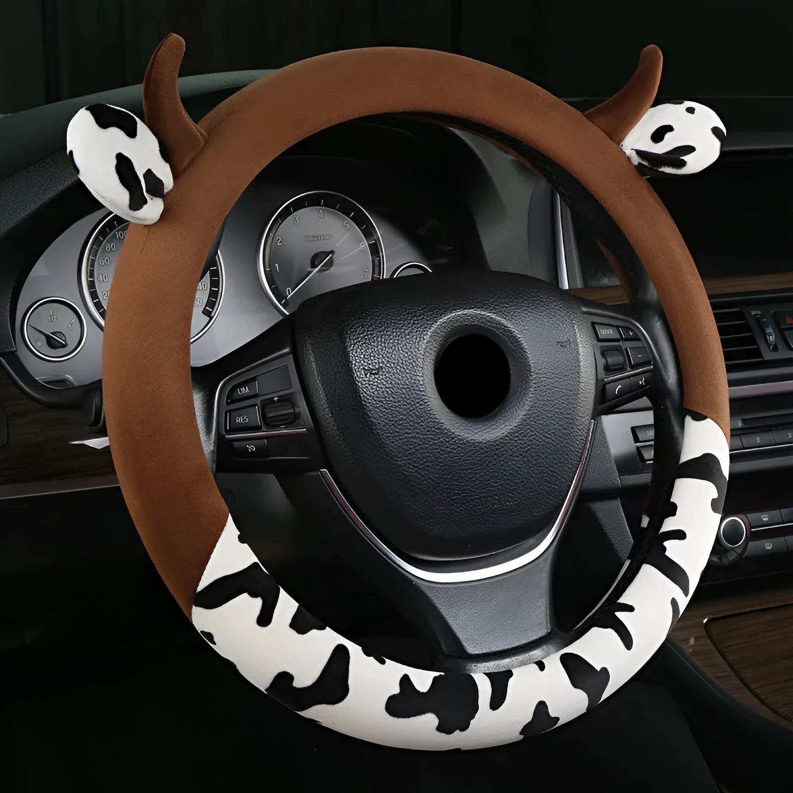 Short plush automotive steering wheel cover in black colour showing soft texture.