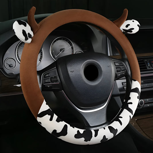 Short plush automotive steering wheel cover in black colour showing soft texture.