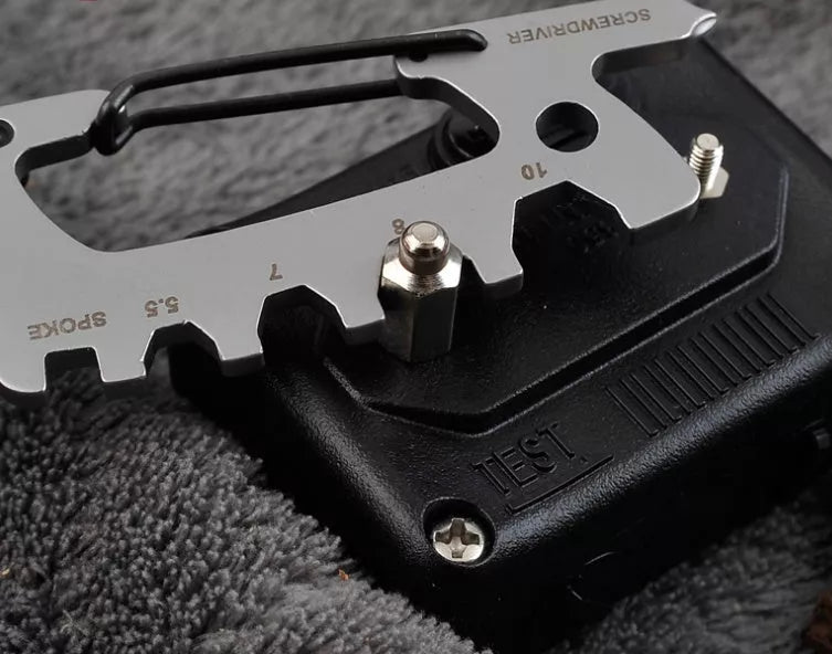 Stainless steel multi-function keychain with geometric gadgets including screwdrivers and hex wrenches