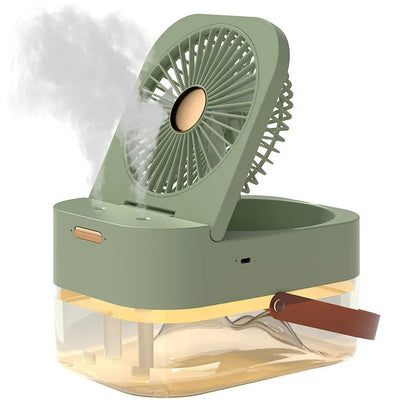 White or green USB desktop mist fan with large water tank, remote control, and dual spray nozzles on a desk.