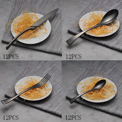 Four-piece black stainless steel cutlery set with mirror polishing showing fork, knife, coffee spoon, and soup spoon