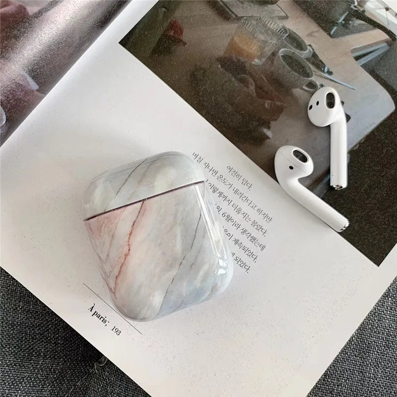 White marble hard PC protective case for AirPods charging box showing scratch protection