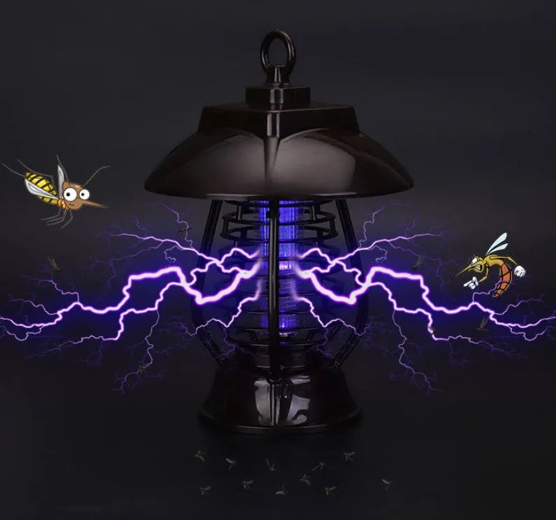 White and black solar-powered electronic mosquito lamp for garden outdoor insect control.