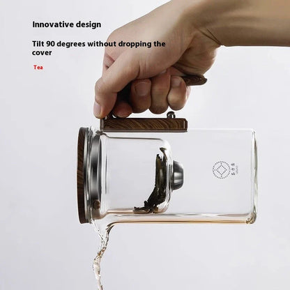 Elegant glass tea infuser pot with magnetic separation technology, wooden handle, and precise pouring spout