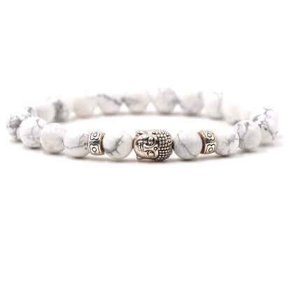 Natural stone stretch bracelet with round beads in various colours including Tigereye and turquoise.