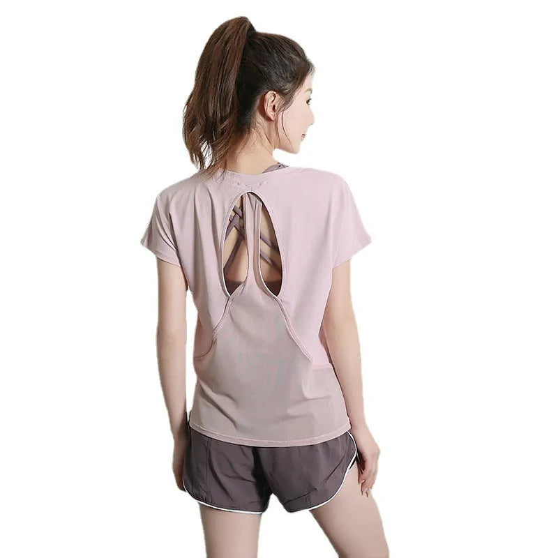 Women's pink short sleeve polyester sports T-shirt for fitness and running.