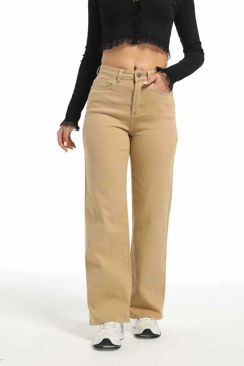 Women's autumn straight jeans in apricot colour showing high waist design and wide leg cut on mannequin