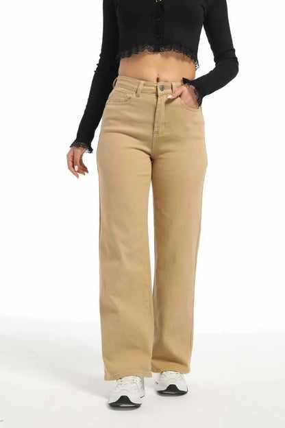 Women's autumn straight jeans in apricot colour showing high waist design and wide leg cut on mannequin