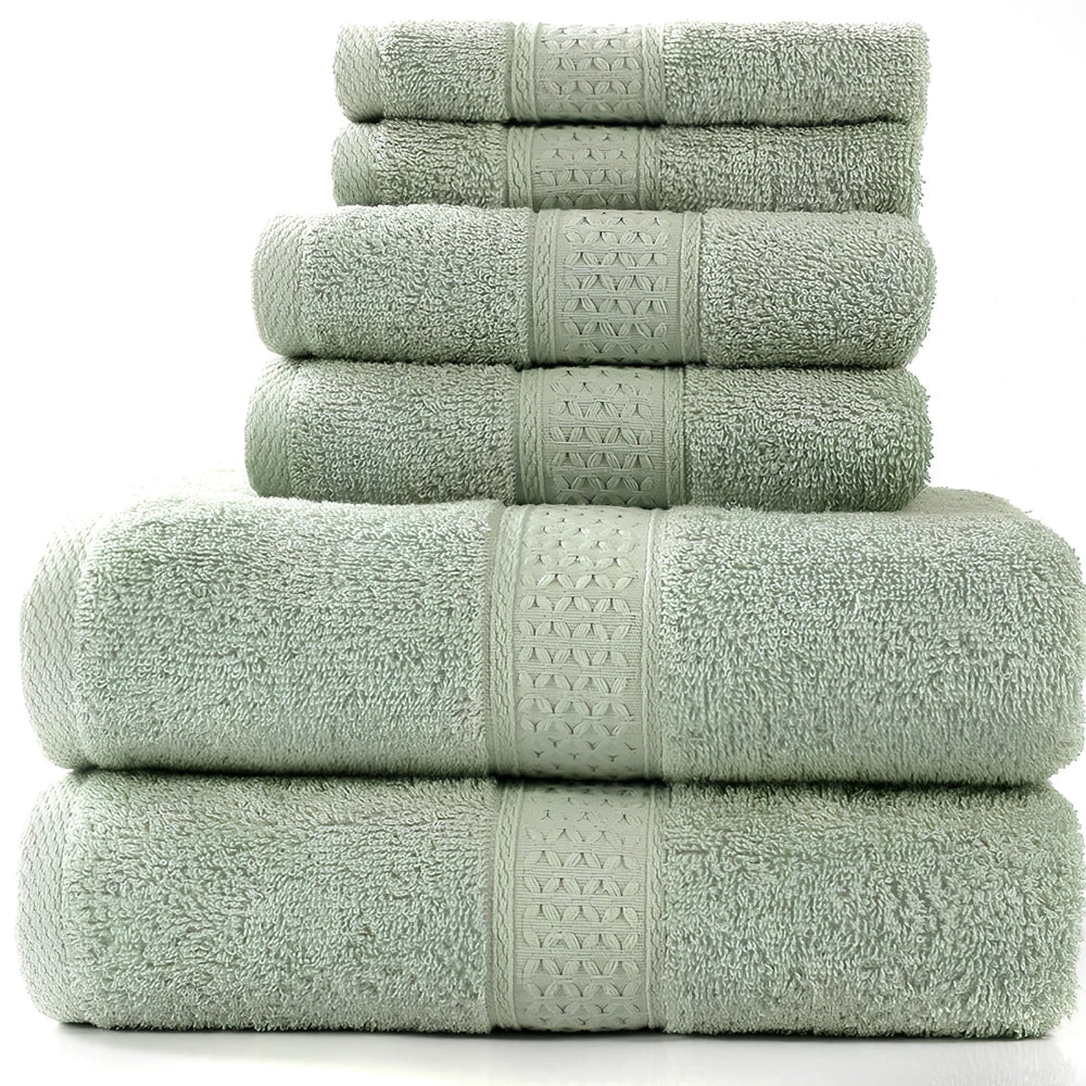 Cotton towel set showing bath towel, hand towel, and face cloth in coordinated sizes
