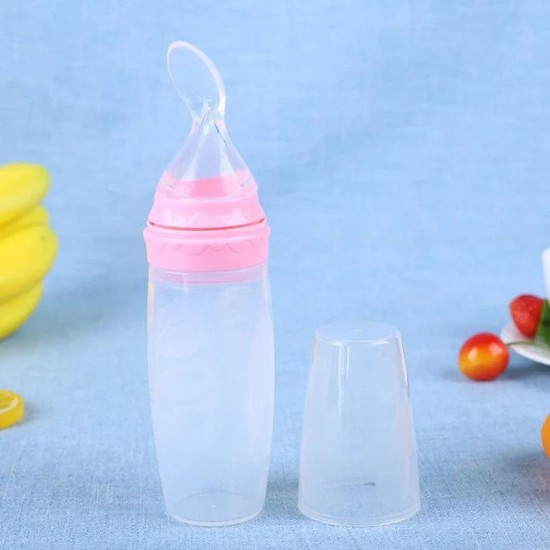 Blue silicone baby feeding spoon with squeeze mechanism, 19.5cm length