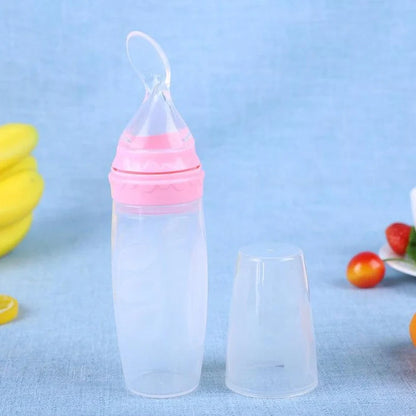 Blue silicone baby feeding spoon with squeeze mechanism, 19.5cm length