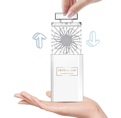 Pink coloured personal perfume fan with USB charging port for aroma diffusion.