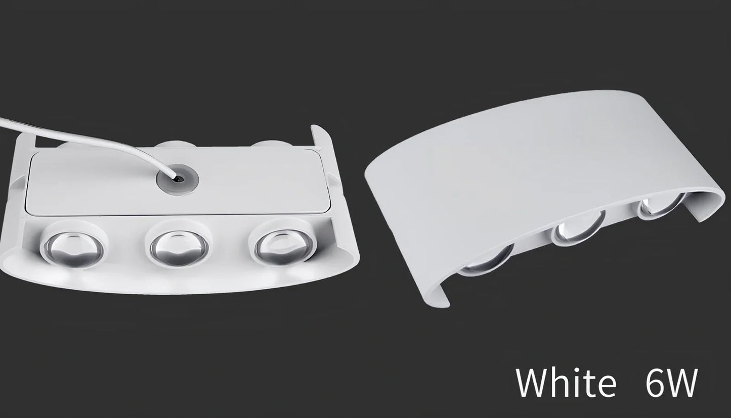 Waterproof black aluminium LED wall lamp 4W warm white emitting 60-degree beam angle mounted on white wall