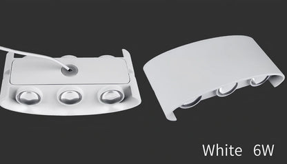 Waterproof black aluminium LED wall lamp 4W warm white emitting 60-degree beam angle mounted on white wall