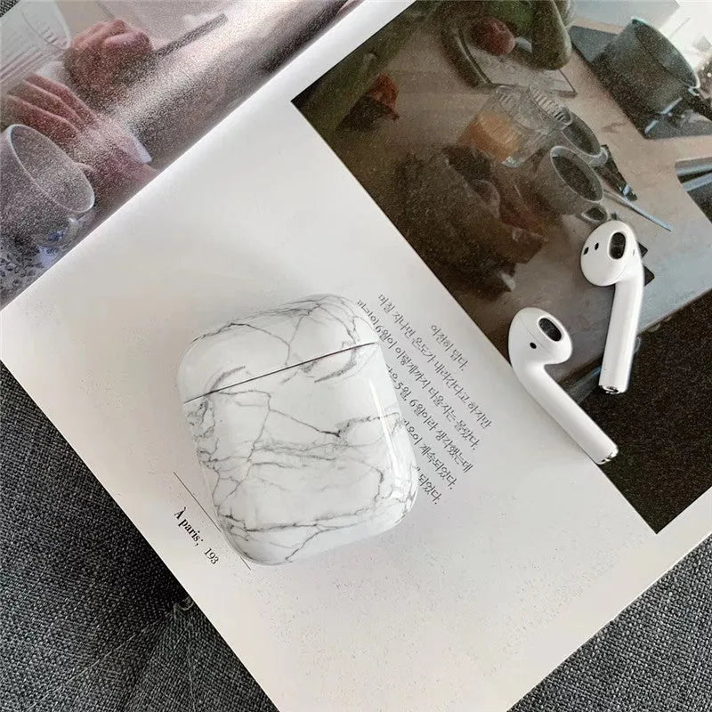 White marble hard PC protective case for AirPods charging box showing scratch protection