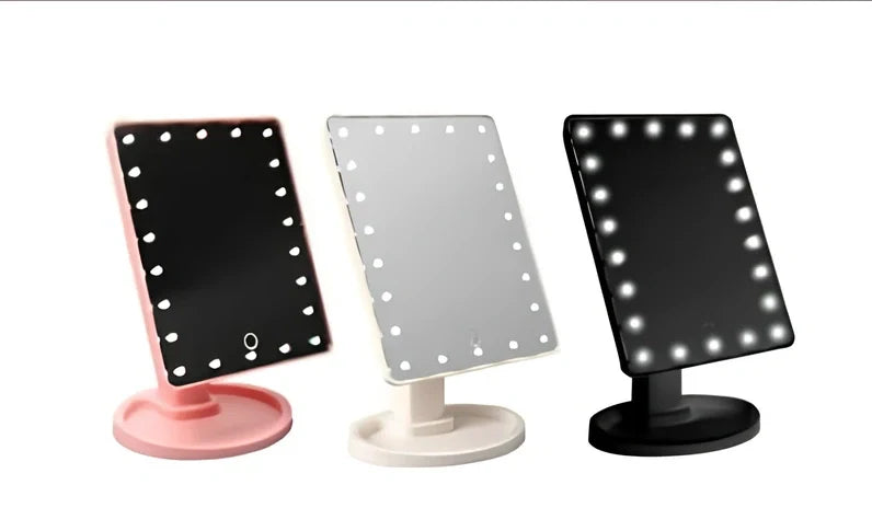 Portable tabletop cosmetic mirror with LED lights around edge, showing 360-degree rotation capability