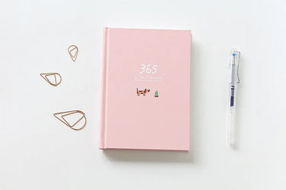 Hardback 365 day planner notebook, 13.5 x 18.2cm, 228 pages, 100gsm white cattle paper, Dark Green or Pink
