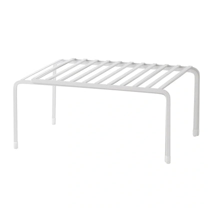 White retractable kitchen shelf extended to 60cm with spices and oils organised on metal surface