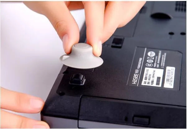 Gray plastic laptop cooling pad stand with two large and two small pads for temperature reduction