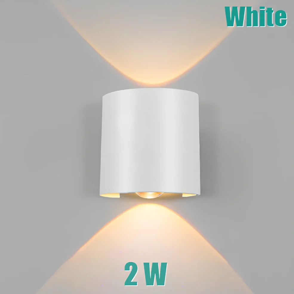 Waterproof black aluminium LED wall lamp 4W warm white emitting 60-degree beam angle mounted on white wall