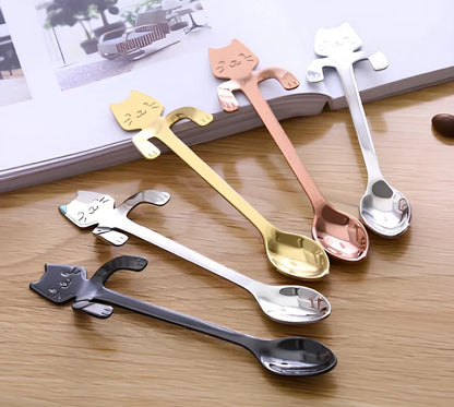 Stainless steel coffee spoon with cartoon cat handle design showing 11.7cm measurement scale