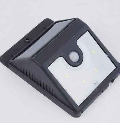 Solar 4 LED sensor lights mounted on a wall, showing 4 LEDs and solar panel, with dimensions 20cm x 10cm x 5cm