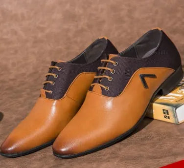 Men's black Oxford shoes with a polished PU upper and durable rubber sole on a wooden floor.