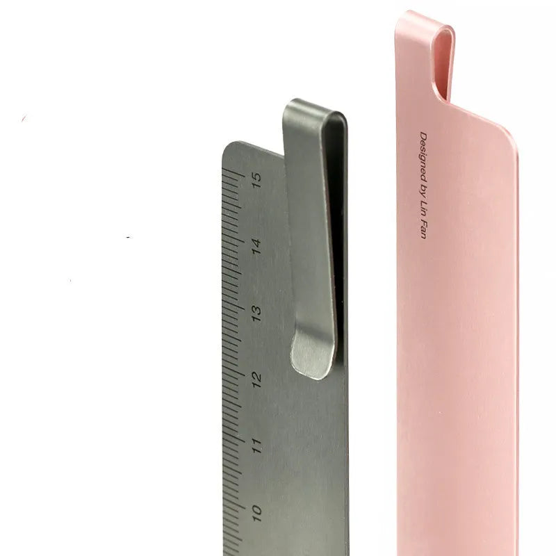 Aluminum bookmark ruler showing 15cm scale with laser-engraved markings in retro design