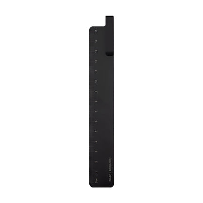 Aluminum bookmark ruler showing 15cm scale with laser-engraved markings in retro design